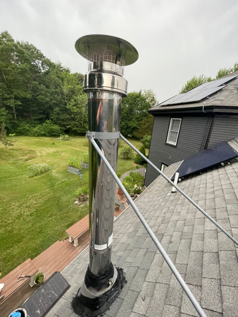 a new chimney pipe that is sealed with tar to make it water proof