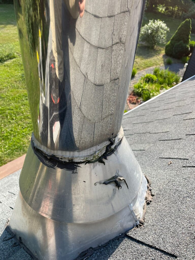 a stove chimney pipe before being serviced and waterproofed by a chimney sweep